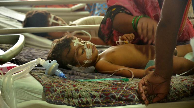 Children receive treatments in the Encephalitis Ward at the Baba Raghav Das Medical College Hospital where over 60 children have died over the past one week, in Gorakhpur district on Monday. (Photo: PTI)