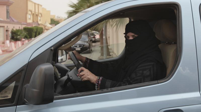 A woman drives a car in Riyadh, Saudi Arabia, as part of a campaign to defy Saudi Arabias ban on women driving. (Photo: AP)