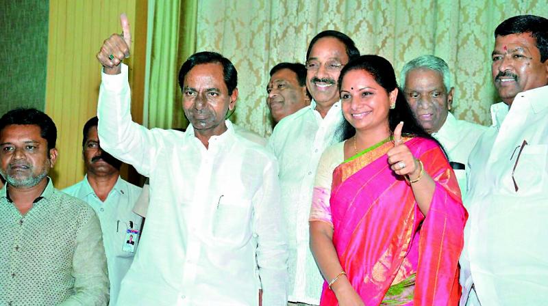 Chief Minister K.T. Rama Rao along with his daughter and Nizamabad MP K. Kavitha thanks supporters at the Pragathi Bhavan on Friday after the TRS-affiliated TBGKS posted big win in the Singareni union elections. (Photo: DC)