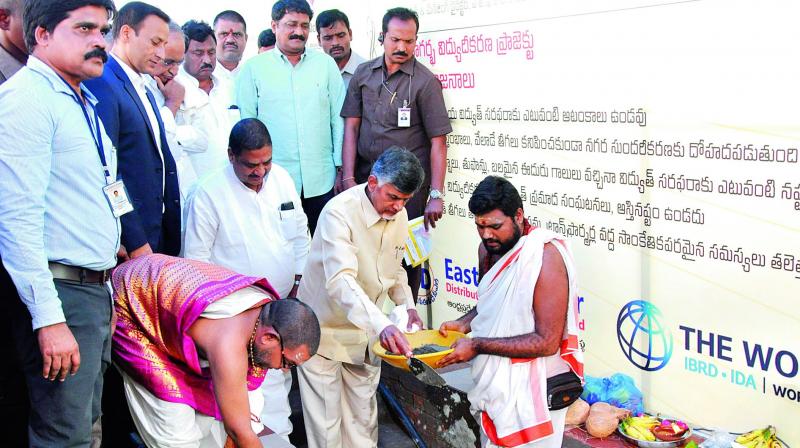 Chief Minister N. Chandrababu Naidu performs the foundation laying ceremony for the underground cable works near Pandurangapuram on the Beach road in Visakhapatnam on Monday. (Photo: DC)