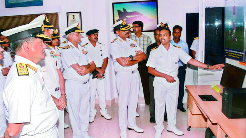 Commander-in-Chief of Eastern Naval Command goes around the Integrated Automatic Aviation Meteorological System (IAAMS) after the inauguration at INS Dega, the Naval Air Station in Visakhapatnam on Friday.