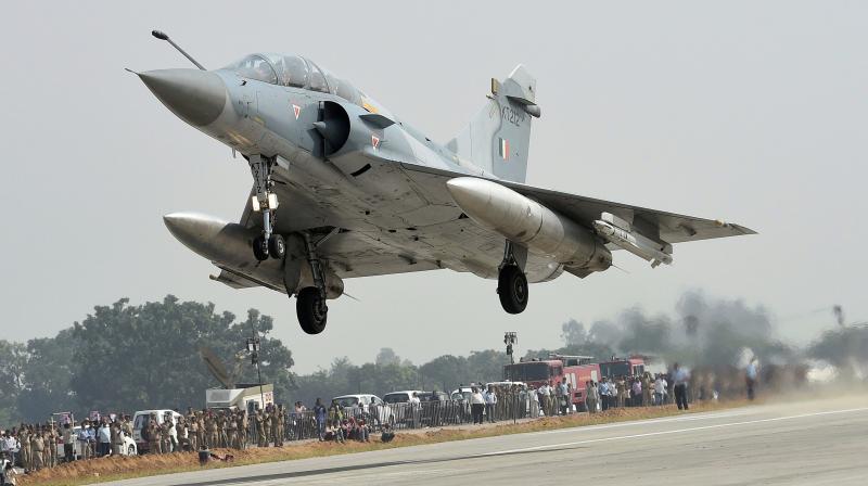 A Mirage 2000 aircraft touches down on Lucknow-Agra Expressway during a drill conducted by Indian Air Force in Uttar Pradesh on Tuesday. (Photo: PTI)