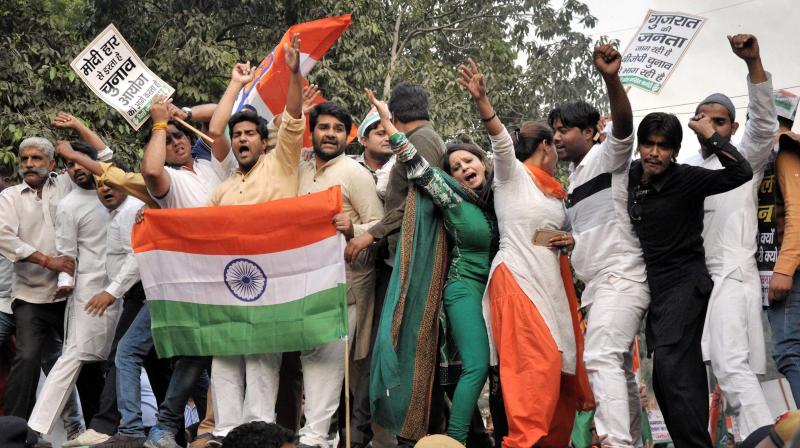Delhi Pradesh Congress Committee activists shout slogans during a protest against BJP, and non- declaration of Gujarat Elections outside Election Commission of India in New Delhi. (Photo: PTI)