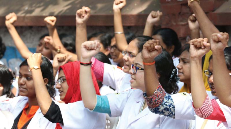 Medical students hold a demonstration in front of Raj Bhavan demanding the withdrawal of National Medical Commission Bill, in Thiruvananthapuram on Monday. (Photo: G.  G. Abhijith.)