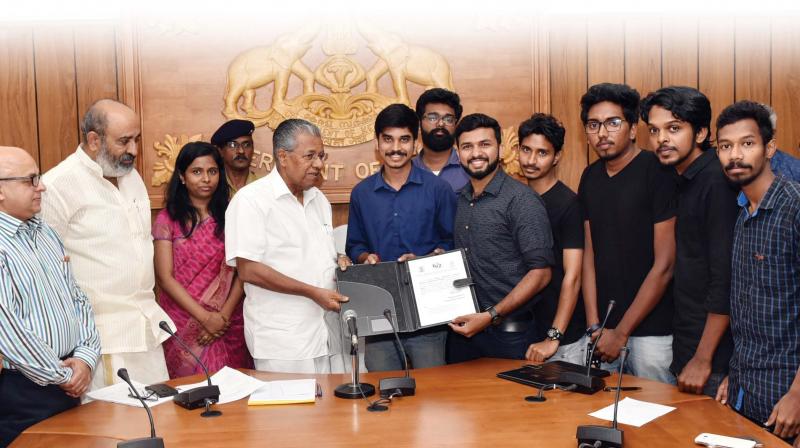Team GenRobotics with Chief Minister Pinarayi Vijayan after signing the MOU with Kerala Water Authority.