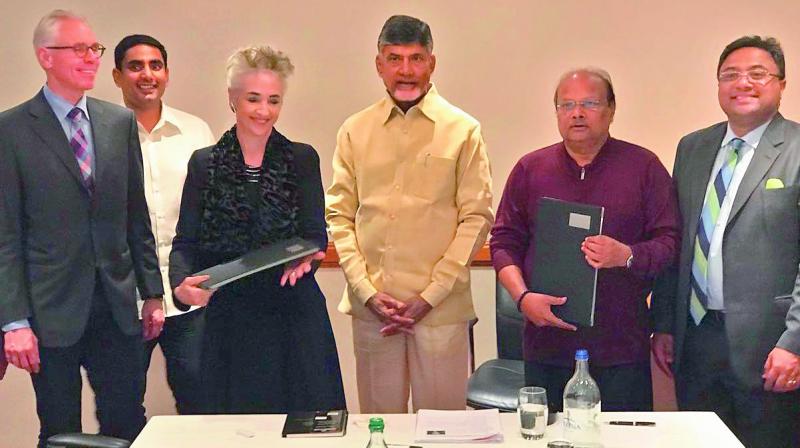 Finance minister Yanamala Ramakrishnudu and AP officials ink MoU with Zurich in the presence of Chief Minister N. Chandrababu Naidu at Davos on Monday.