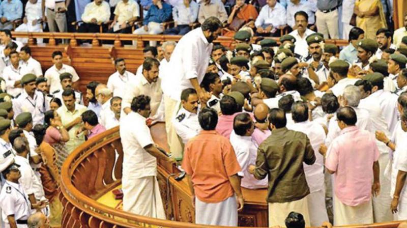 File photograph of former LDF MLAs in confrontation in the state Assembly.