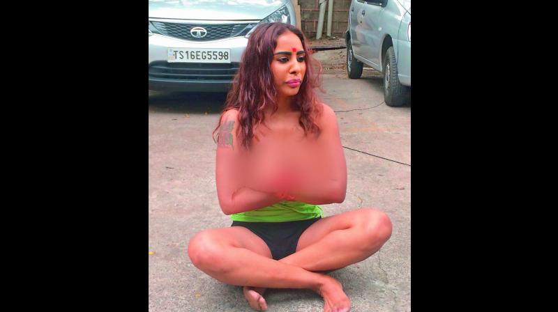 Sri Reddy during strip protest in front of the Film Chamber in Film Nagar on Saturday.