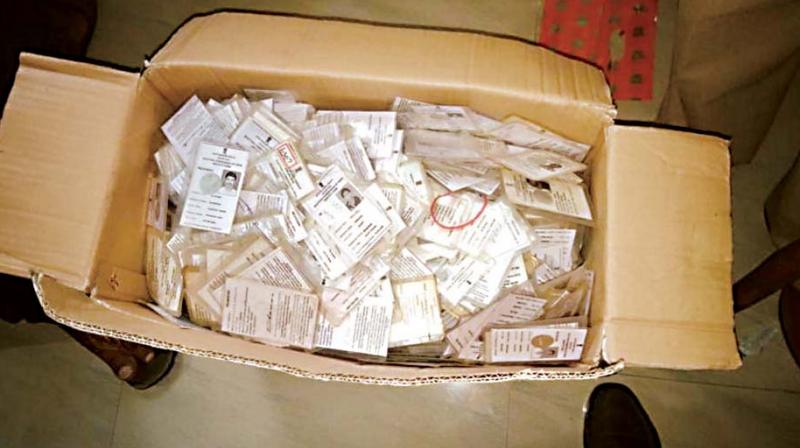 Voter ID cards seized from an apartment in RR Nagar constituency.