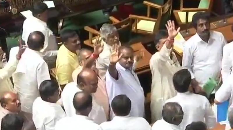 Congress DK Shivkumar, JD(S)s HD Kumaraswamy & other MLAs at Vidhana Soudha after resignation of BJPs BS Yeddyurappa as Chief Minister of Karnataka. (Photo: Twitter/ANI)