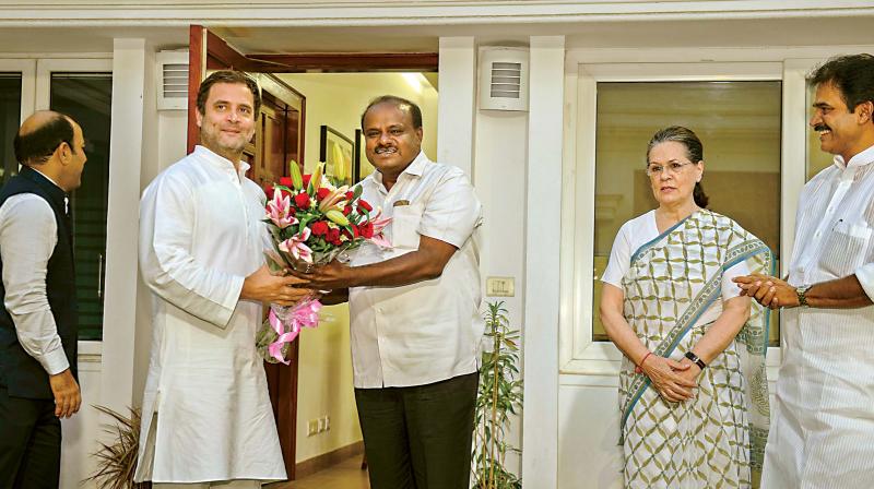 The bouquets first! JD(S) leader and Karnataka chief minister-designate H D Kumaraswamy with Congress president Rahul Gandhi, UPA chairperson Sonia Gandhi and Congress General Secretary and Karnataka in-charge K.C. Venugopal in New Delhi on Monday. (Photo: PTI)