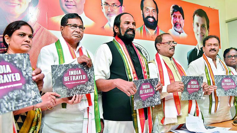 AICC Telangana state incharge R.C. Khuntia, TPCC president N. Uttam Kumar Reddy, CLP leader K. Jana Reddy, Leader of the Opposition in TS Legislative Council Mohammed Ali Shabbir and former TPCC president Ponnala Lakshmaiah releasing a  booklet on India Betrayed against the Narendra Modi government at Gandhi Bhavan in the city on Saturday. (Photo: DC)