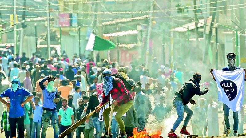 Mourners resort to stone pelting after clashes with the security forces on Saturday. (Photo: PTI)