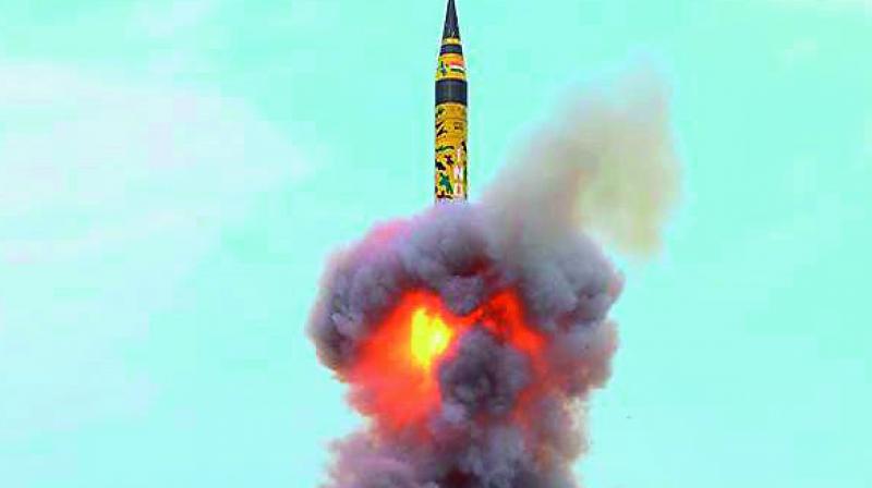Agni-5 lifts off during a successful test-fire from a mobile launch pad in Odisha on Sunday. (Photo: PTI)