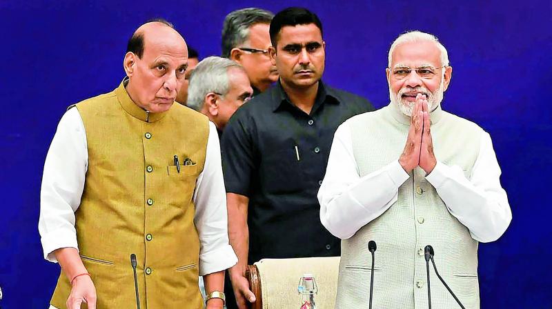 Pime Minister Narendra Modi with home minister Rajnath Singh at the fourth meeting of the Governing Council of Niti Aayog, in New Delhi on Sunday. (Photo: PTI)