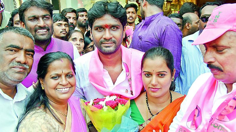 TRS MP Talasani Saikiran Yadav with his family members after filing his nomination papers on Monday. He has an MBA from Australia and is a businessman by profession. (Image DC)