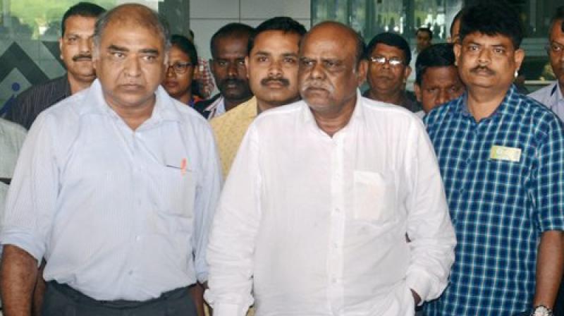 Former Calcutta High Court judge C S Karnan upon his arrival at the airport in Kolkata on Wednesday. (Photo: PTI)
