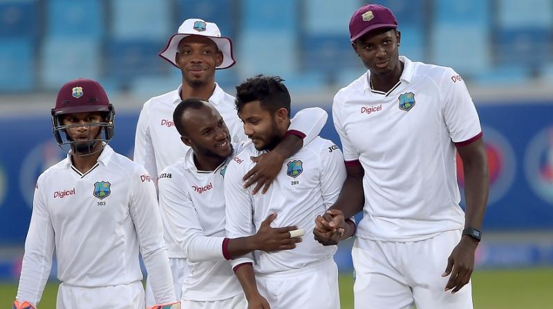 Devendra Bishoo scalped 8 wickets for 49 as West Indies bundled out Pakistan for 123 in the second innings of the first Test. (Photo: AFP)