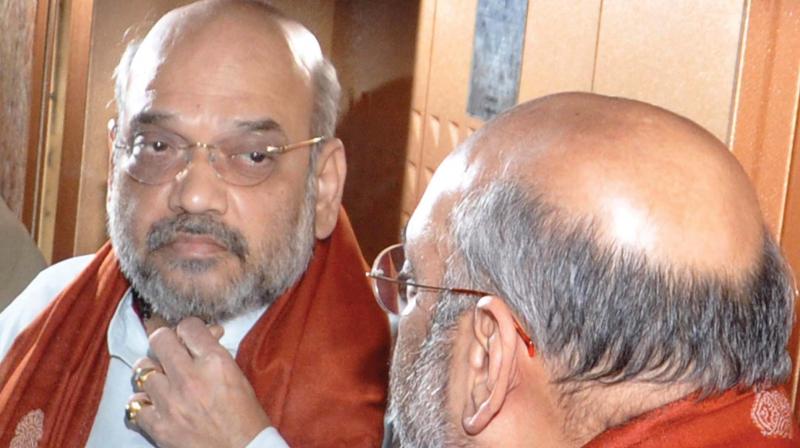 BJP president Amit Shah is having close look at his own reflection in the mirror inside the lift of the government guest house in Kochi on Friday. Shah arrived in Kochi as part of his three-day Kerala visit. (Photo: SUNOJ NINAN MATHEW)