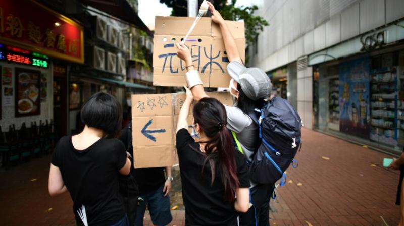Hong Kongers defy police ban and gather for \anti-triad\ rally