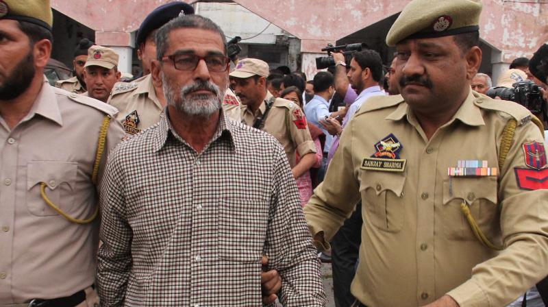 Sanji Ram, the main accused in Kathua rape and murder case, being produced in District Court in Kathua. (Photo: PTI/File)