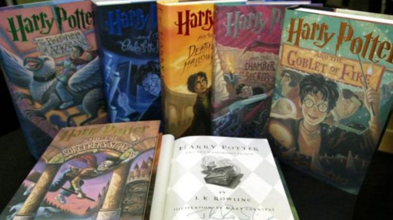 US school bans \Harry Potter\ series, stating risk of \conjuring evil spirits\