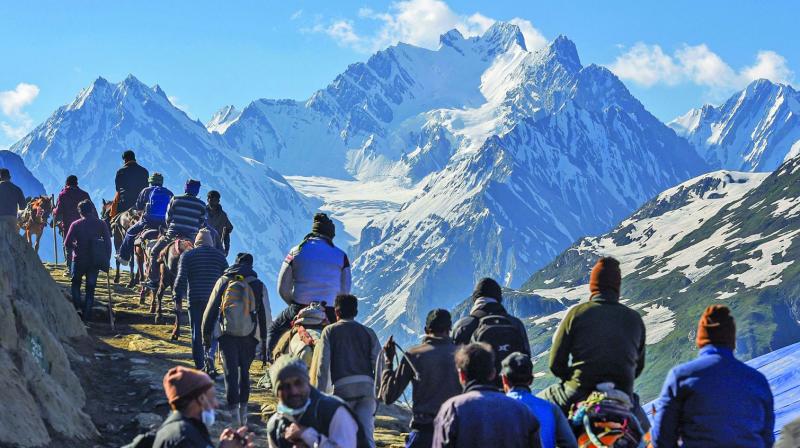 Devotees on their way to the holy cave shrine of Amarnath near Baltal on Monday (Photo: AP)