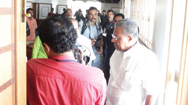 Chief minister Pinarayi Vijayan asks mediapersons to get out from the venue of a peace meet at Mascot Hotel on Monday. (Photo: A.V. MUZAFAR)