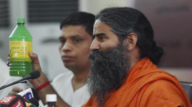 Baba Ramdev who founded Patanjali Ayurved says Rs 20 lakh crore will be market size of apparel and dairy products. (Photo: PTI)
