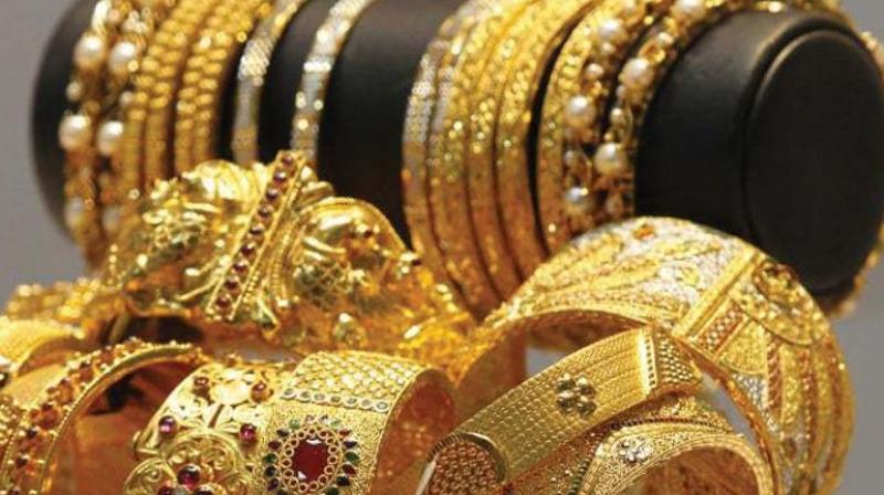 Gold prices dropped by 0.28 per cent to USD 1,225 an ounce in New York.