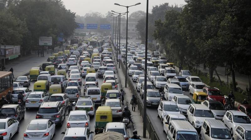 Vehicles at a traffic intersection in New Delhi. The ministry of road transport and highways has said motor vehicles sold on and after December 1, 2017 shall be fitted with FASTag. (Photo: AP | File)