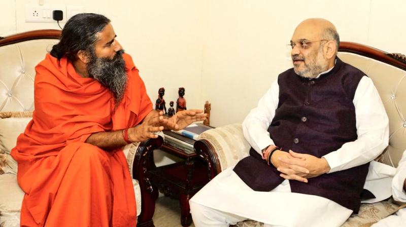BJP president Amit Shah met yoga guru Ramdev today to seek his support for the 2019 general election, as part of a new Sampark for Samarthan campaign. (Photo: Twitter | @AmitShah)