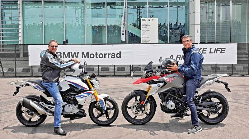 Vikram Pawah, president, BMW Group India, and Dimitris Raptis, head of BMW Motorrad (Region Asia, Pacific, China, South Africa) with newly launched BMW motorcycles.
