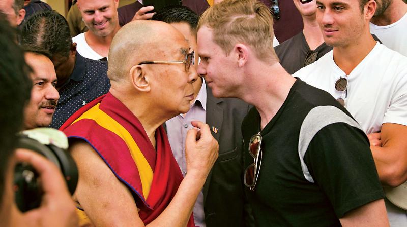 Tibetan spiritual leader the Dalai Lama and Australian cricket captain Steven Smith at an interaction with the team, at the Tsuglakhang temple in Dharamsala on Friday. (Photo: AP)