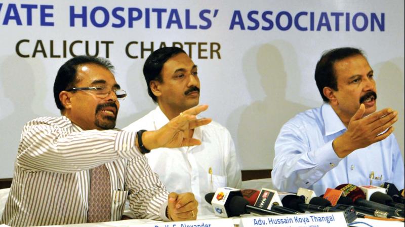 Dr K. G. Alexander, Hussain Koya Thangal (general secretary, KPHA) and Dr Azad Moopen representative of Kerala Private Hospitals Association address the mediapersons in Kozhikode on Friday. (Photo: Venugopal)