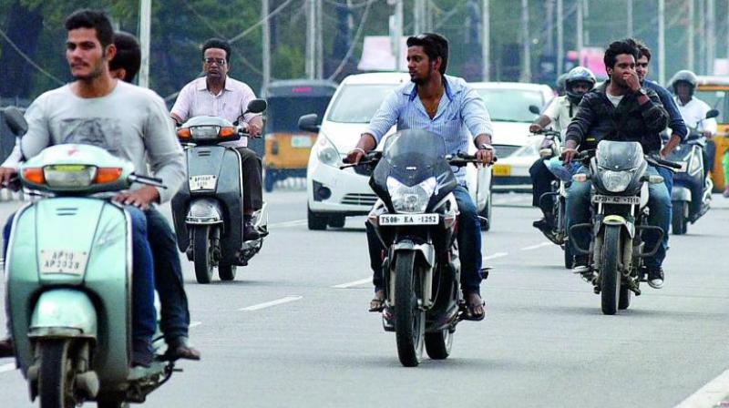The violators if caught travelling on a motorcycle without a helmet or insurance papers are being let off after purchasing the same from vendors near the police station. (Photo: DC)  (Representational image)