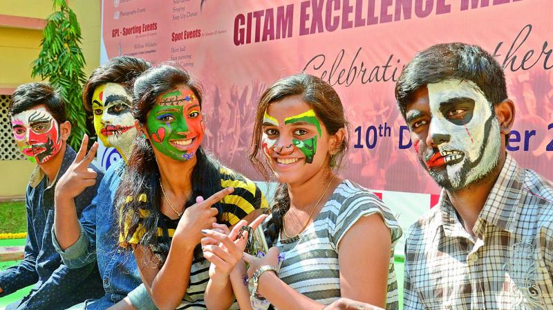 Students from various colleges take part in the Face-painting competition during the Gitam Excellence Meet at Gitam University Campus in Visakhapatnam on Friday. (Photo: DC)
