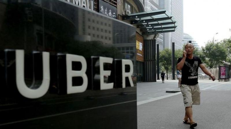 Uber is a world leader in mobile app based taxi services. (Photo:AFP)