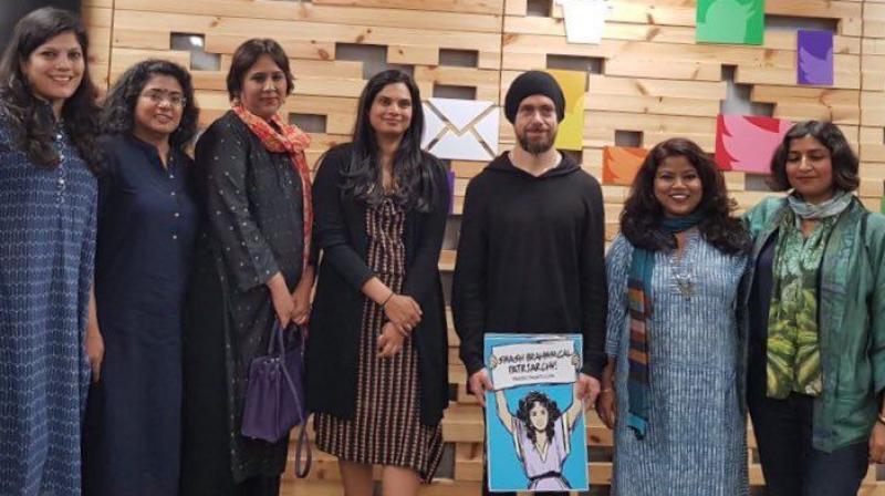 Twitter CEO Jack Dorsey on his maiden visit to India poses with a poster reading  Smash Brahminical patriarchy  given by a Dalit activist. The snap was taken after a round table with journalists, activists, writers and officials of Twitter.