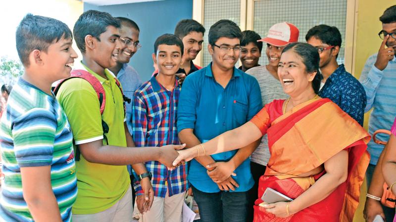 A teacher from the Everwin School, Kolathur, shares a happy moment with students, after the CBSE class 10 results were out on Saturday. (Photo: DC)
