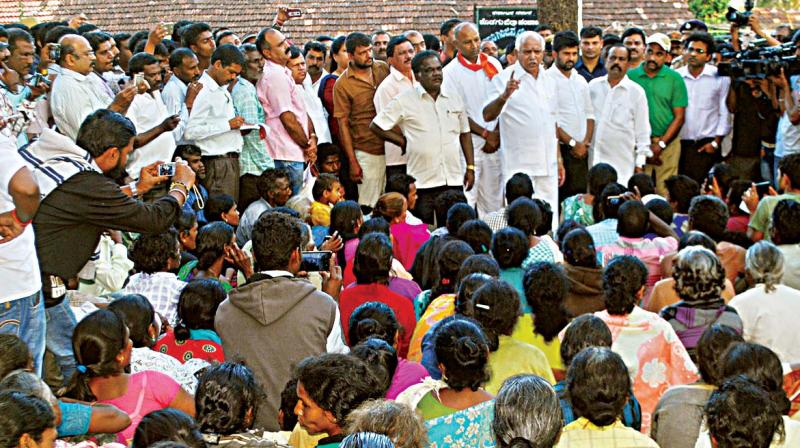 BJP state president and former CM B.S. Yeddyurappa addresses tribals protesting for alternate land in Diddalli in Kodagu district on Tuesday.