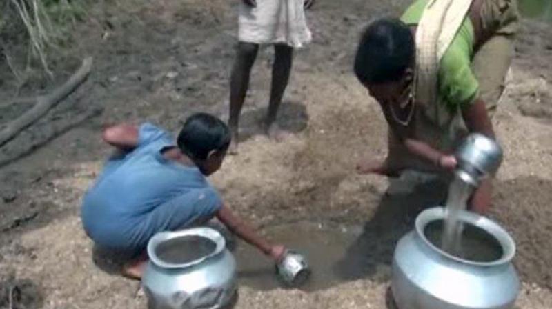 Villagers dig out almost blackened water and use it for their daily chores like cooking, washing and drinking. (Photo: ANI)