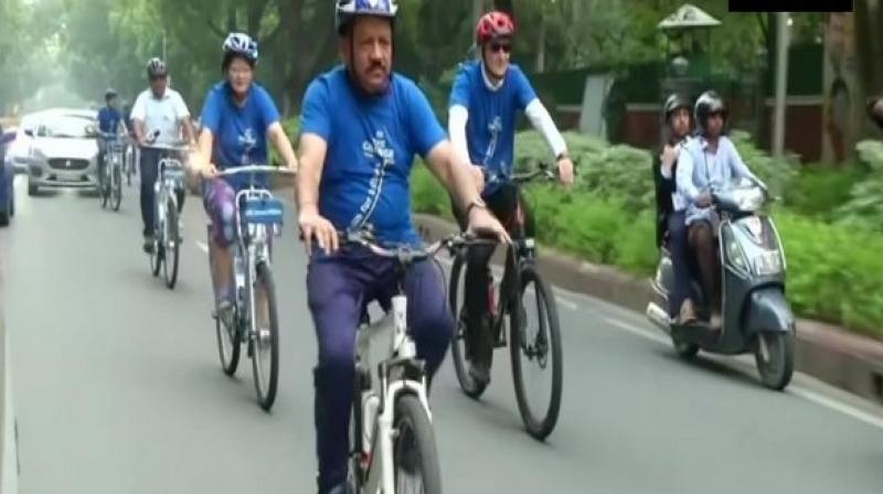 Harsh Vardhan cycles to WHO meet, participates in yoga session