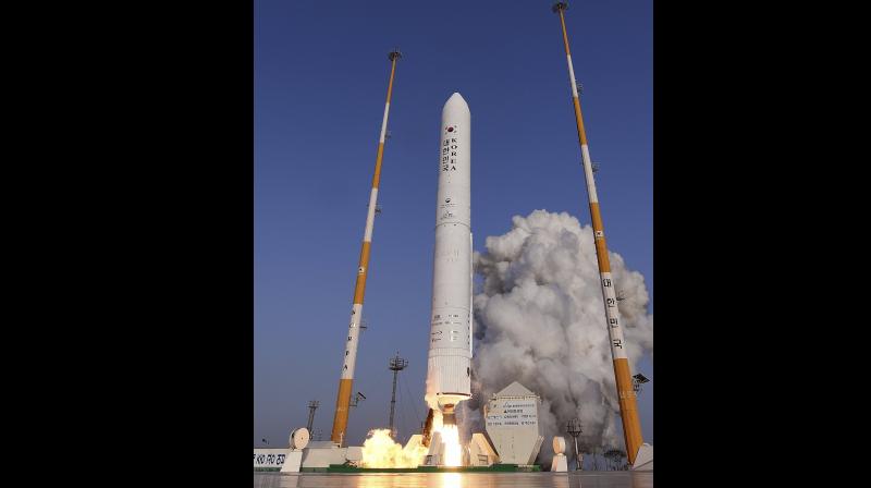 In this photo provided by Korea Aerospace Research Institute, a single stage rocket takes off from its launch pad at the Naro Space Center in Goheung, South Korea, Wednesday, November 28, 2018. (Korea Aerospace Research Institute via AP)