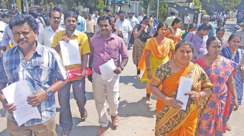 Parents of students studying in Amrita Vidyalayam  petition district collector urging him to ensure that they are not forced to purchase accessories by the school.(DC)