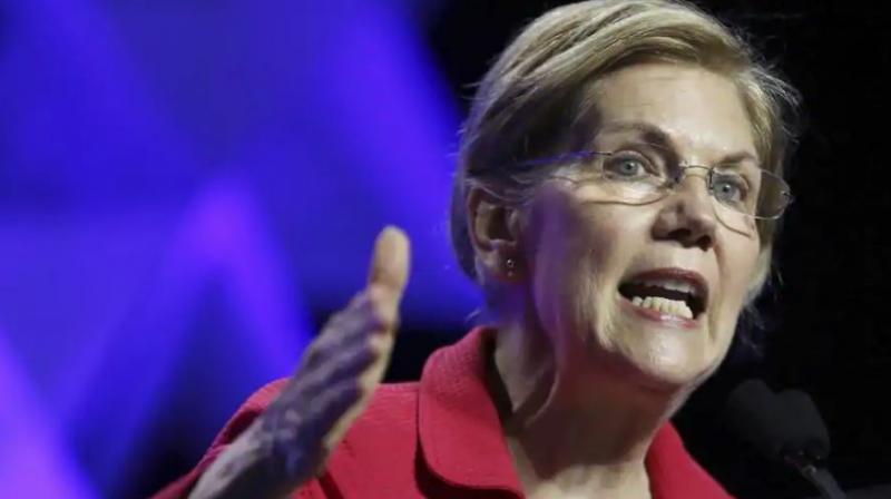 Warren tweeted that Trump is a cowardly elitist and she wont sit quietly for Trumps racism so she took the test. (Photo: AP)