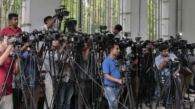 Mediapersons are particularly concerned about a provision in the law under which journalists can be convicted of espionage for entering a government office and gathering information secretly using electronic device -- an offence that would carry a 14-year jail sentence. (Photo: AP)