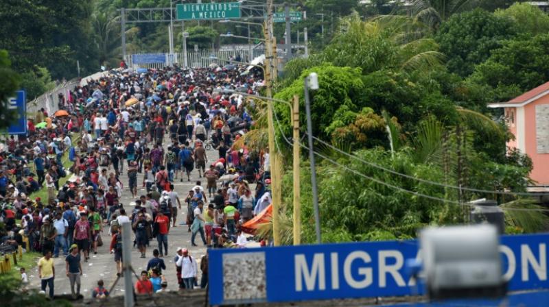 Honduran migrants taking part in a caravan heading to the US arrive at a border crossing point with Mexico in Ciudad Tecun Uman, Guatemala on October 19, 2018. (Photo: AFP)