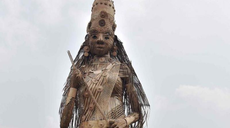 The 101-foot-tall idol by the Bishnupur Sarbajanin Puja Committee has been made by Assams famed artiste Nuruddin Ahmed and his team. (Photo: AFP)
