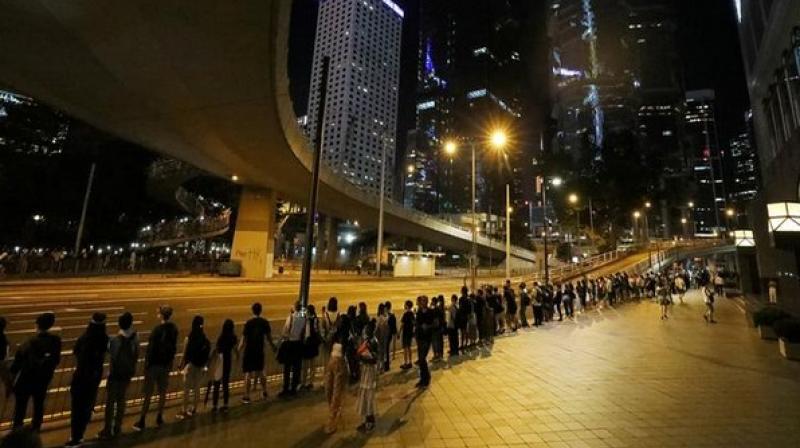 30 years after â€˜Baltic Wayâ€™, Hong Kong protesters form human chain across city
